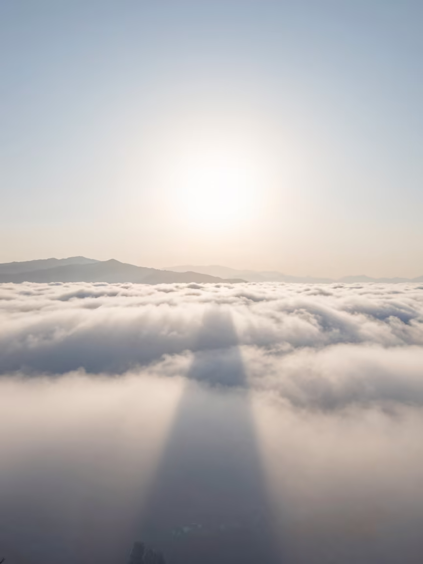 Glory Halo Shadow on Winter Clouds at Lijiang Dawn in through low marine fog near Lijiang