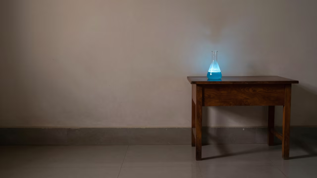 Glowing Flask on Rajshahi Desk in on a writing desk in Rajshahi