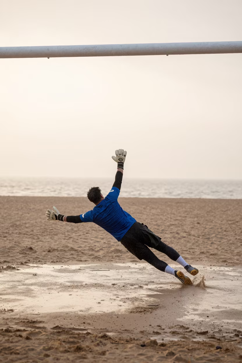 Goalkeeper Dives on Dalian Beach at Sunrise in along a beach near Dalian