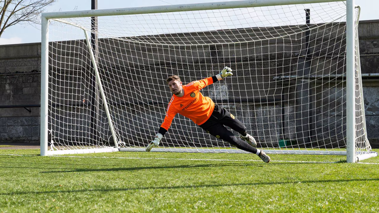 Goalkeeper Dives Under Floodlights at Harbor Quay in at a harbor quay near Hanover