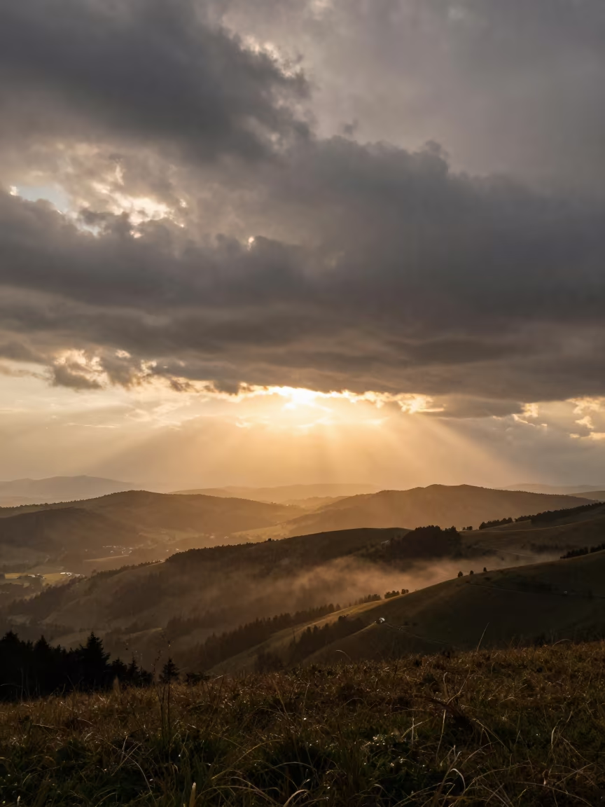 Golden Crepuscular Rays Over Austrian Thunderheads in in Austria