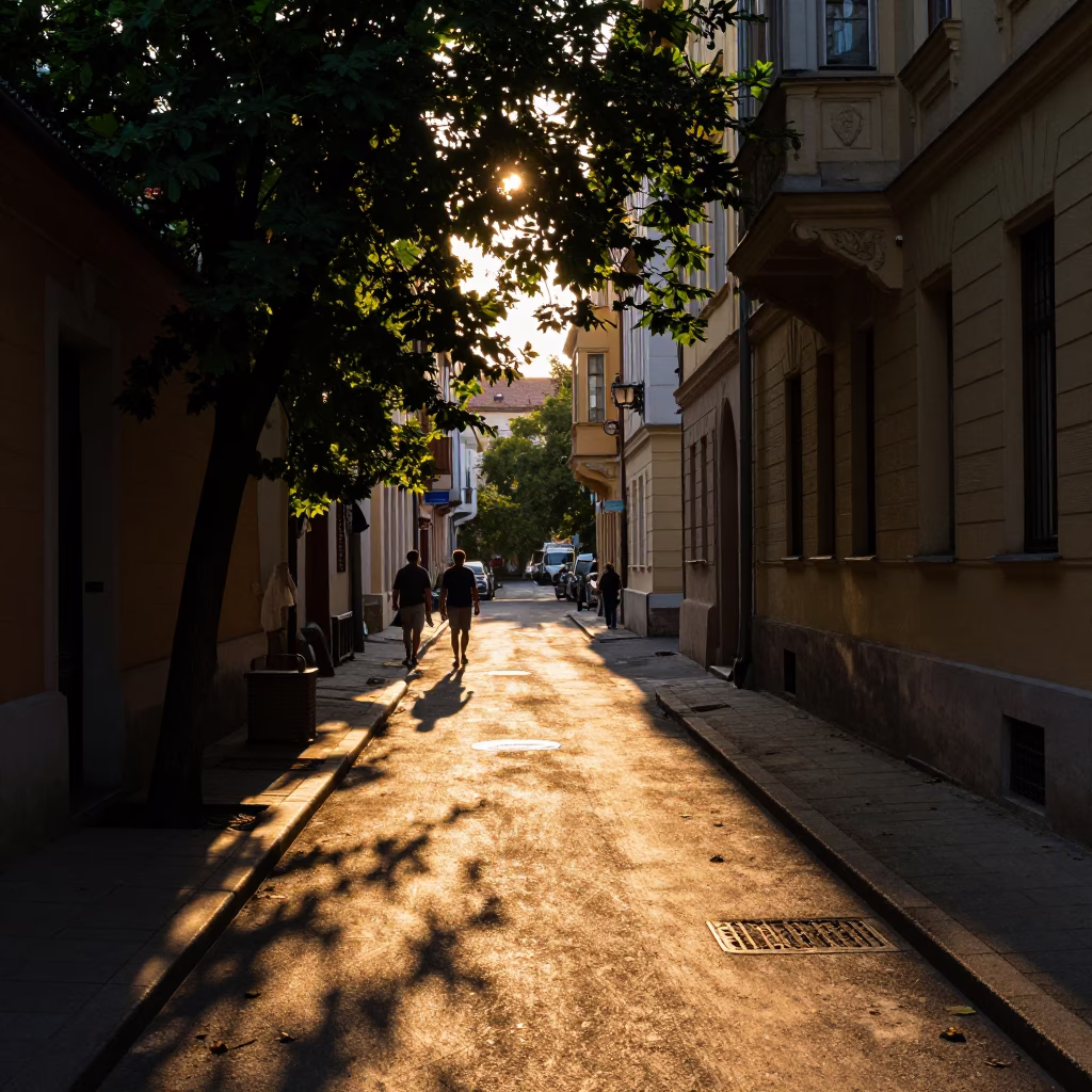 Golden Hour Budapest Street Scene with Dappled Shadows and Local Life in in Budapest, Hungary