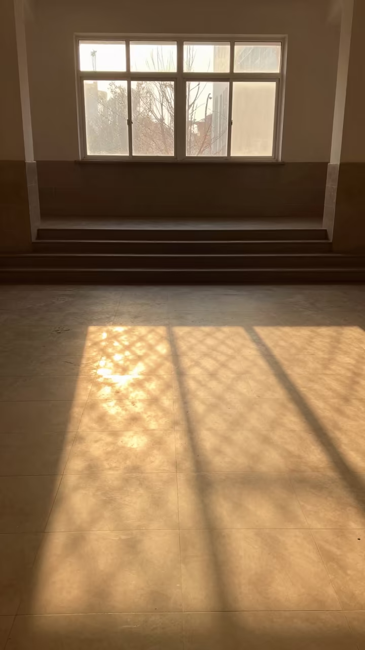 Golden Hour Chain Link Fence Shadow Pattern in inside a tiled stair hall near Tianjin