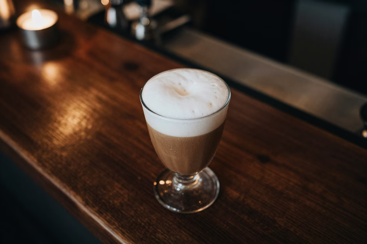 Golden Hour Egg Coffee with Condensation in at a coffee bar counter in Kyiv