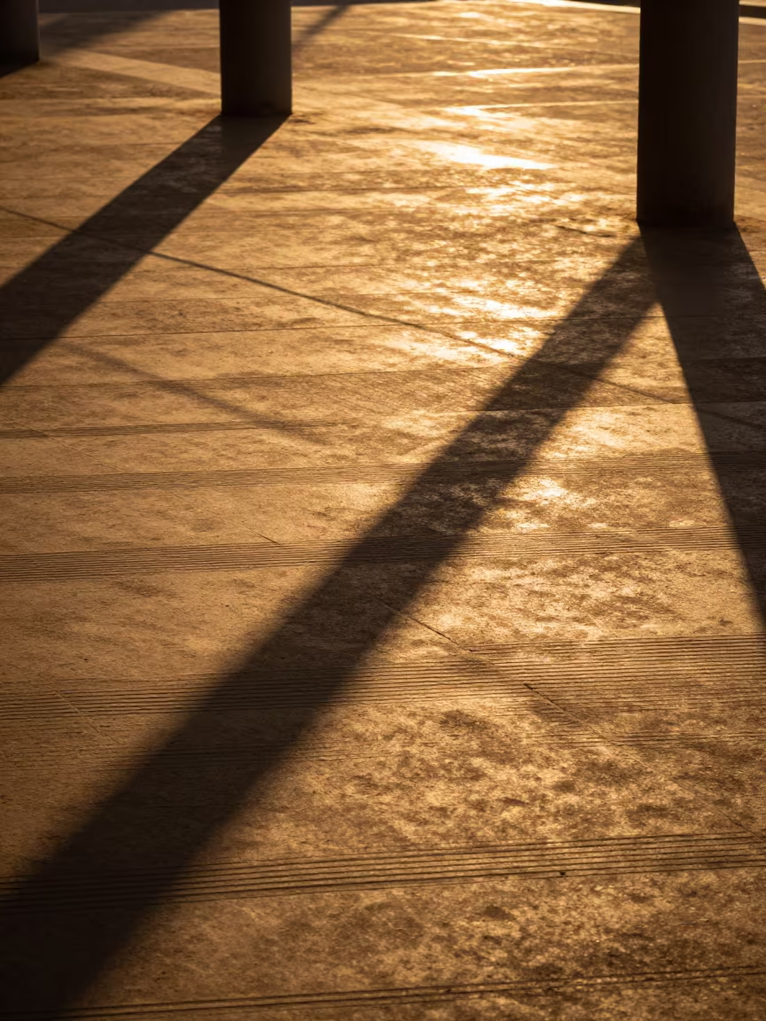 Golden Hour Grid Shadows on Concrete Road in inside a ribbed concrete lobby in Windhoek