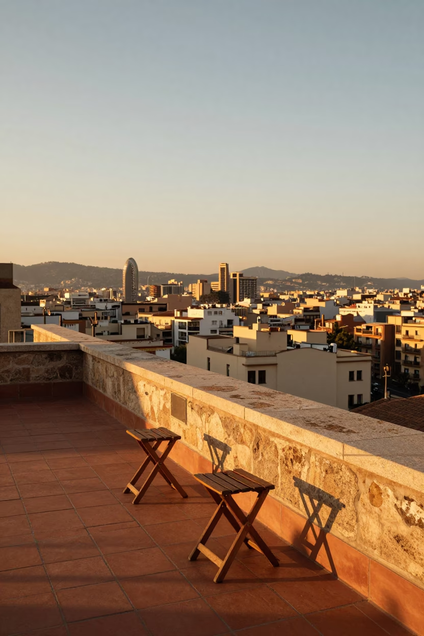 Golden Hour Light on Barcelona Rooftops with Folding Stools and City View in in Barcelona, Spain