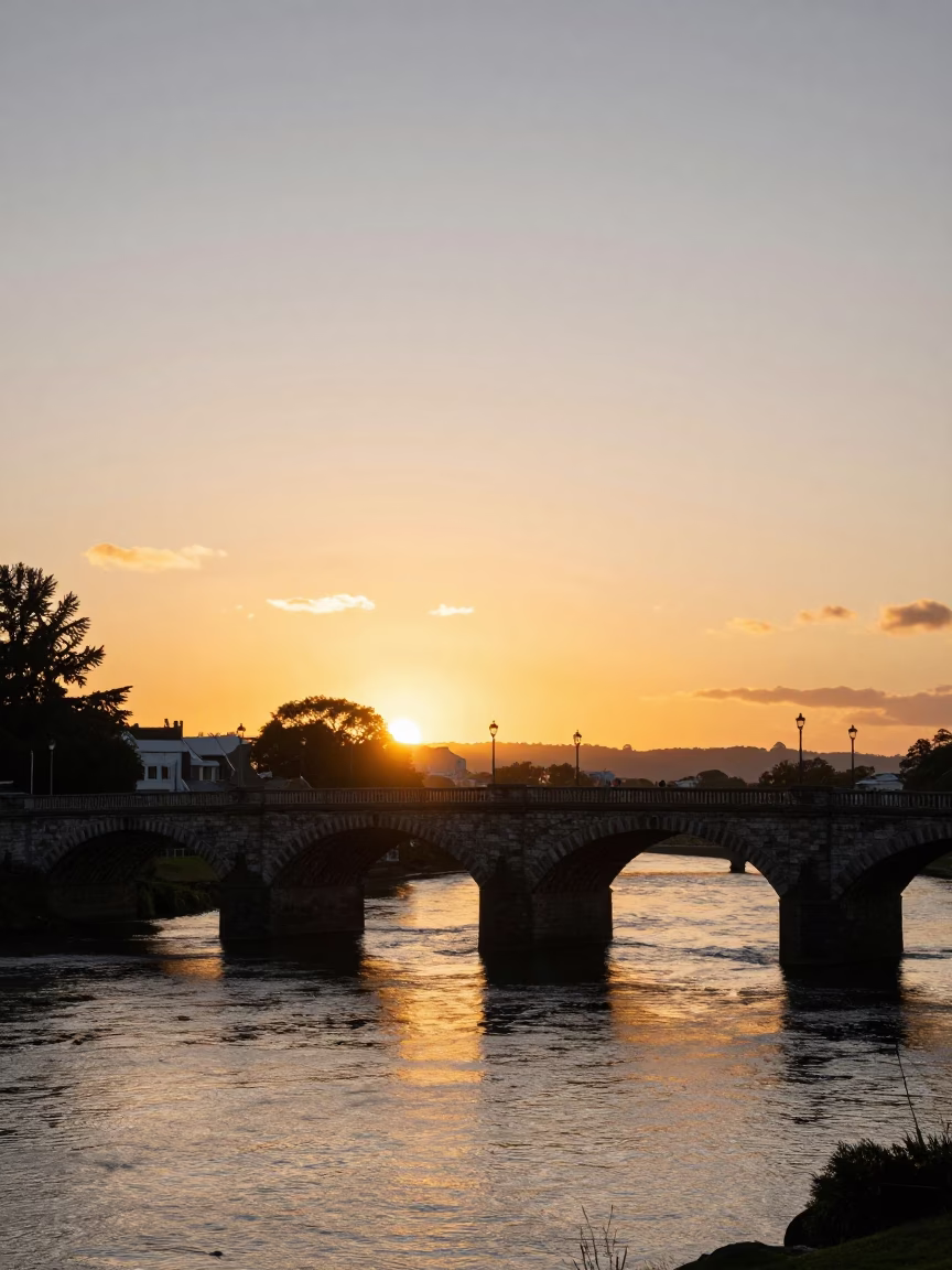 Golden Hour Light on Christchurch Avon River and Heritage Stone Bridge in in Christchurch, New Zealand