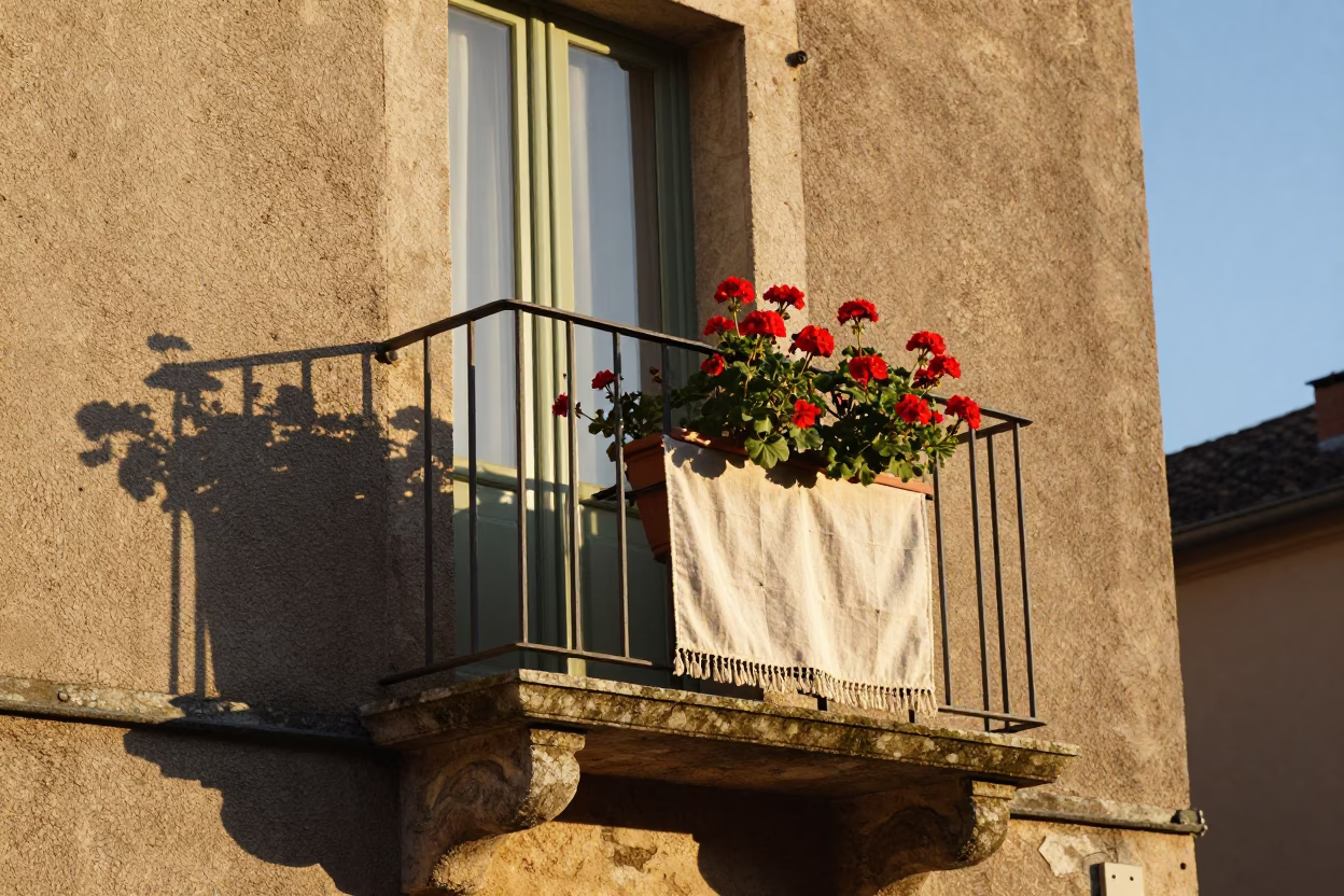 Golden Hour Light on Nice Balcony with Flowerpot and Linen Fringe in in Nice, France