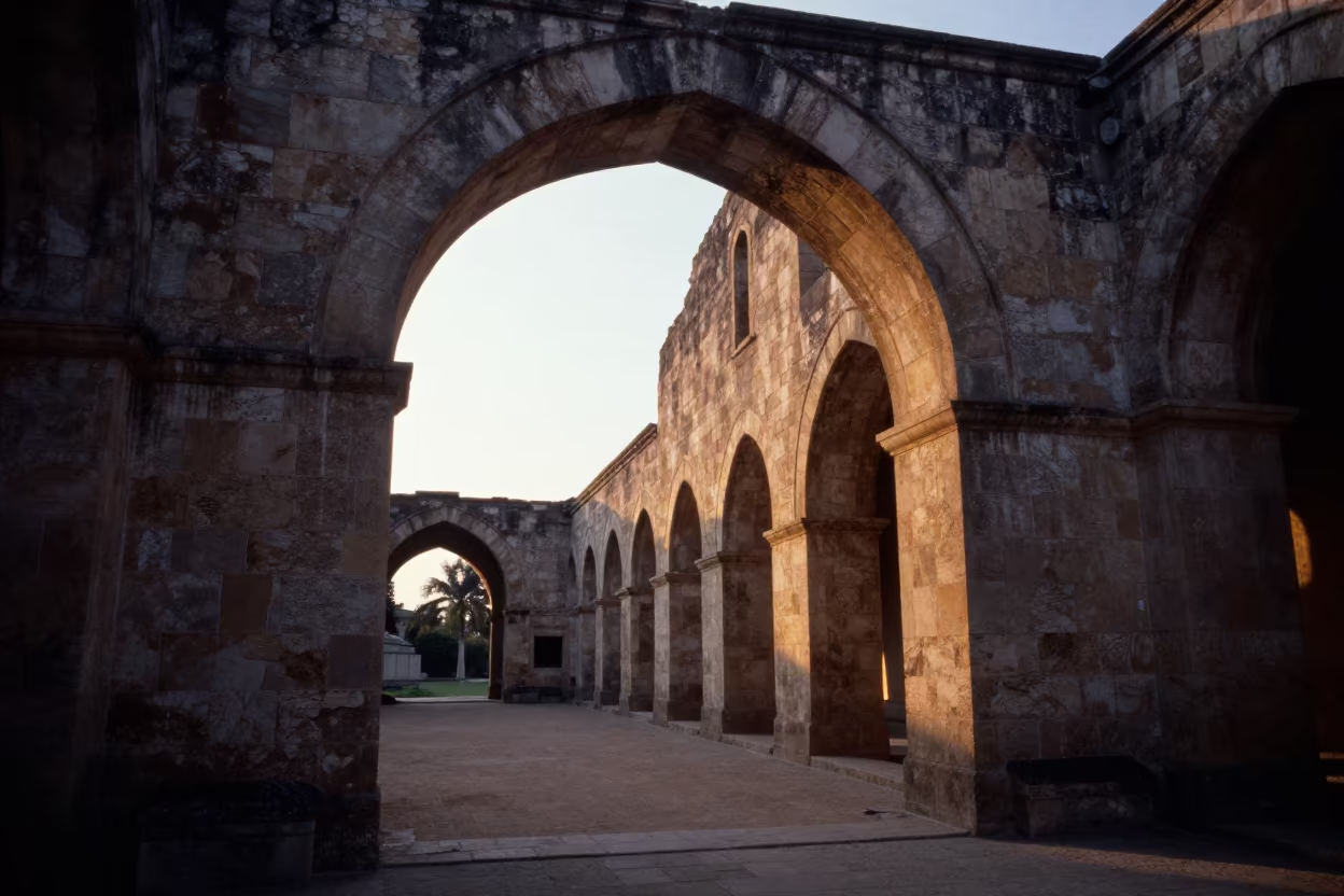 Golden Hour Light Through Sandstone Arch in Bouafe Abbey in along a monastery corridor in Bouaflé
