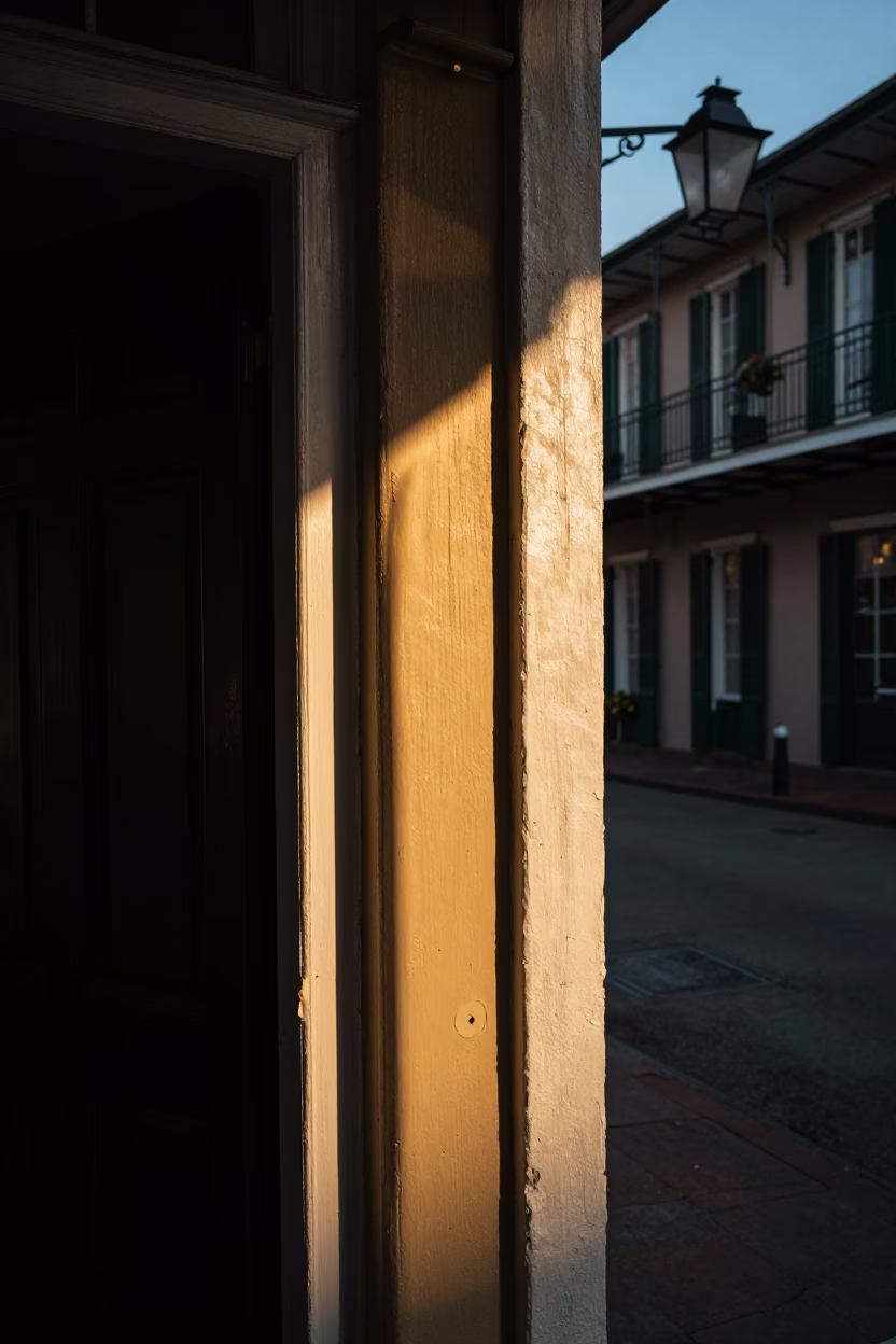 Golden Hour Light Striking French Quarter Doorframe and Vintage Street Scene in New Orleans in in New Orleans, Louisiana, United States