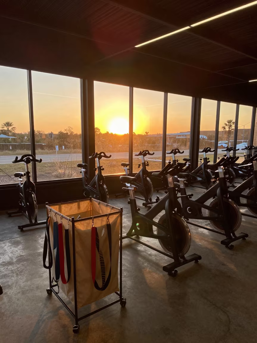 Golden Hour Spin Studio Stretch Strap Hamper in inside a spin studio under class lights in San Antonio