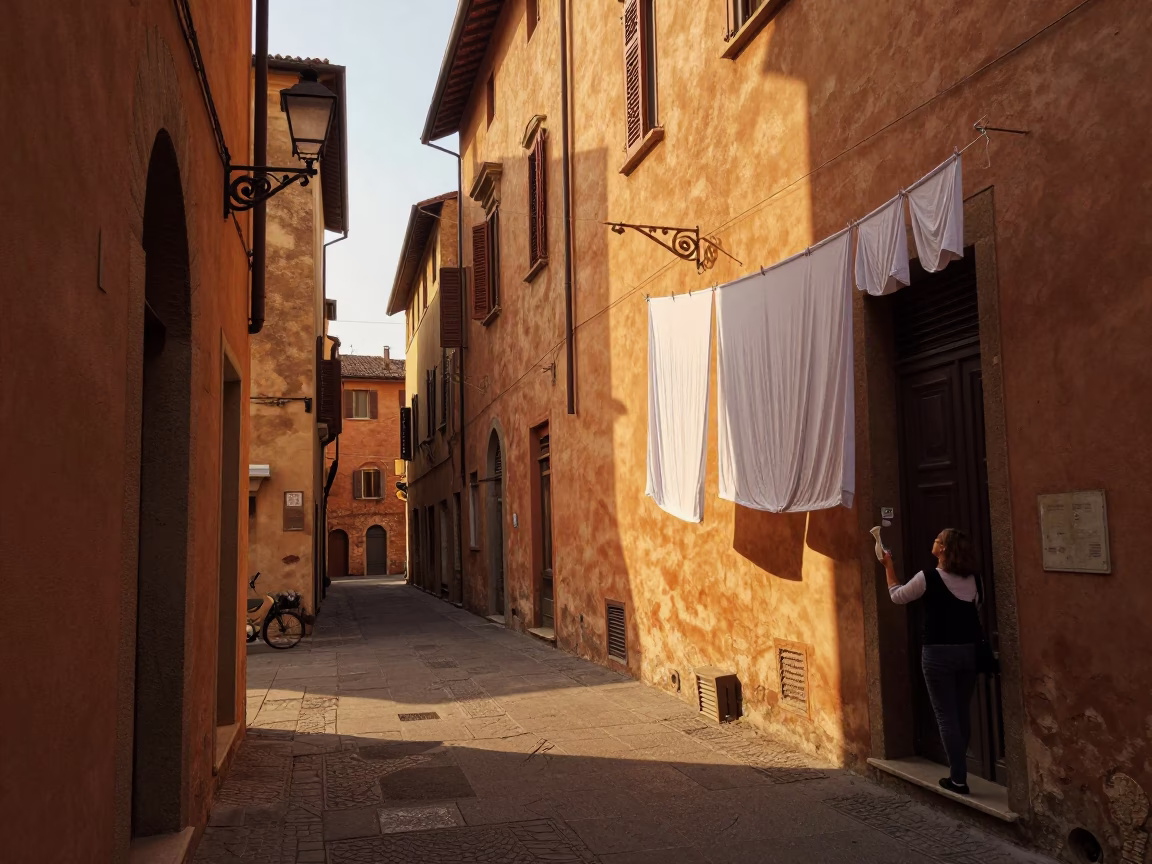 Golden Hour Street Scene in Bologna Italy with Laundry and Sconce in in Bologna, Italy
