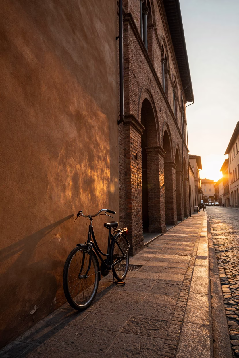 Golden Hour Street Scene in Bologna Italy with Vintage Bicycle and Historic Architecture in in Bologna, Italy