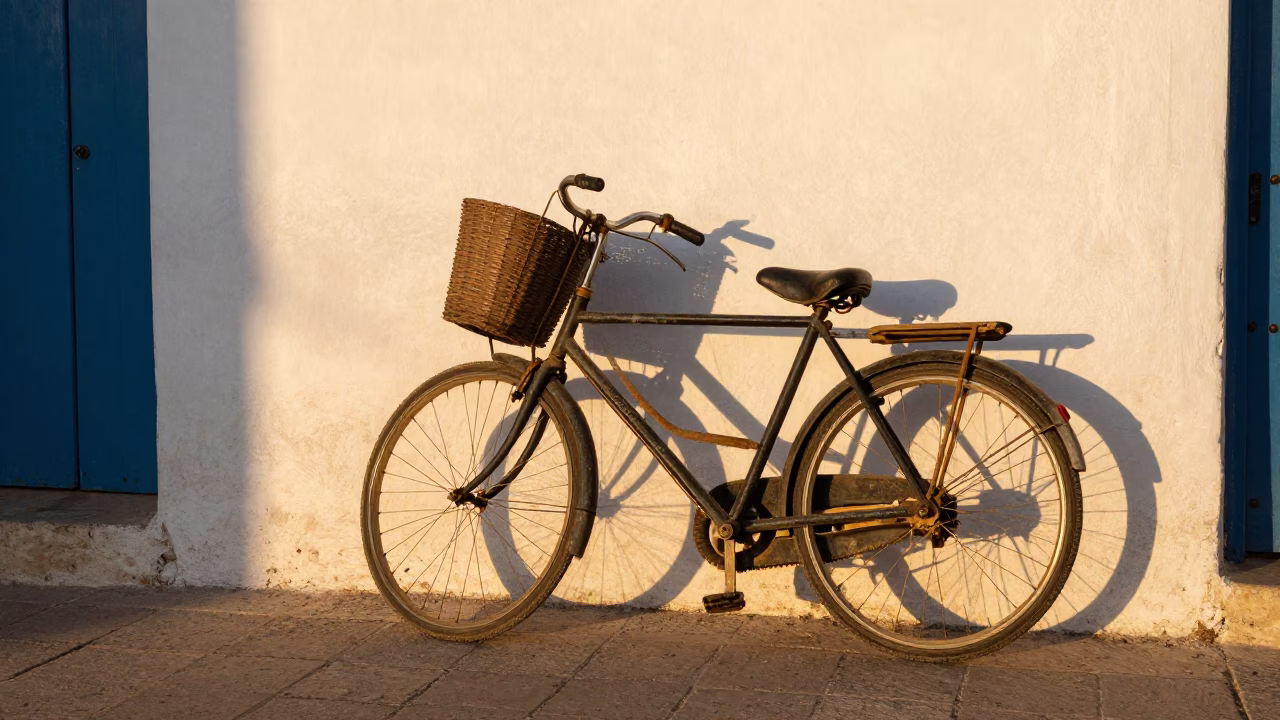 Golden Hour Street Scene in Essaouira Morocco with Bicycle Basket and Fish Scale Patterns in in Essaouira, Morocco
