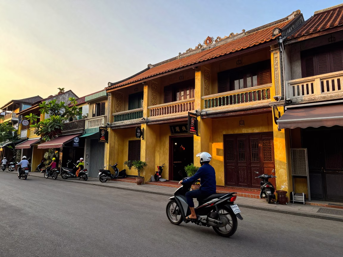 Golden Hour Street Scene in Hanoi Vietnam with Motorbikes and Traditional Architecture in in Hanoi, Vietnam