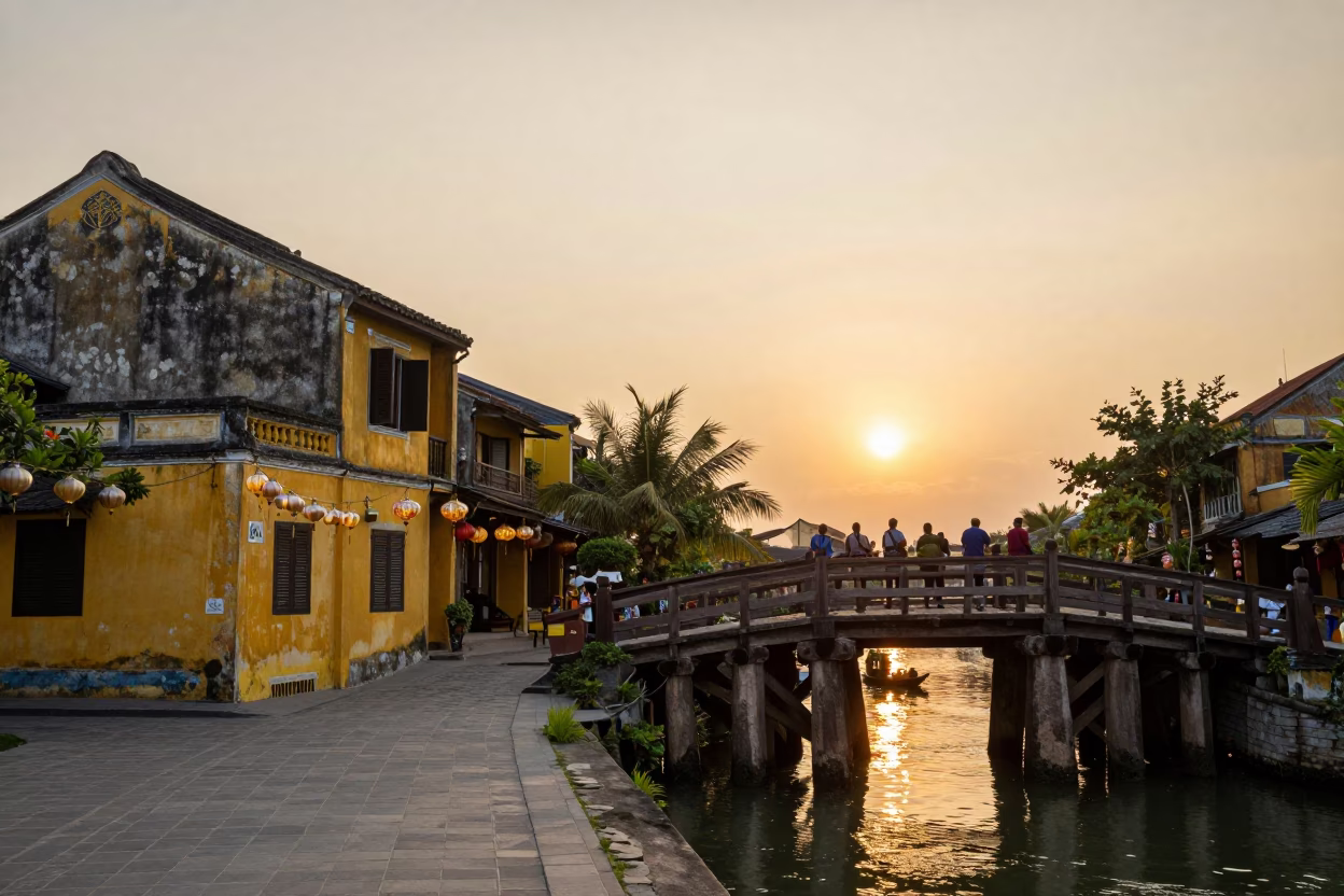Golden Hour Street Scene in Hoi An Vietnam with Hanging Lanterns and River Bridge in in Hoi An, Vietnam