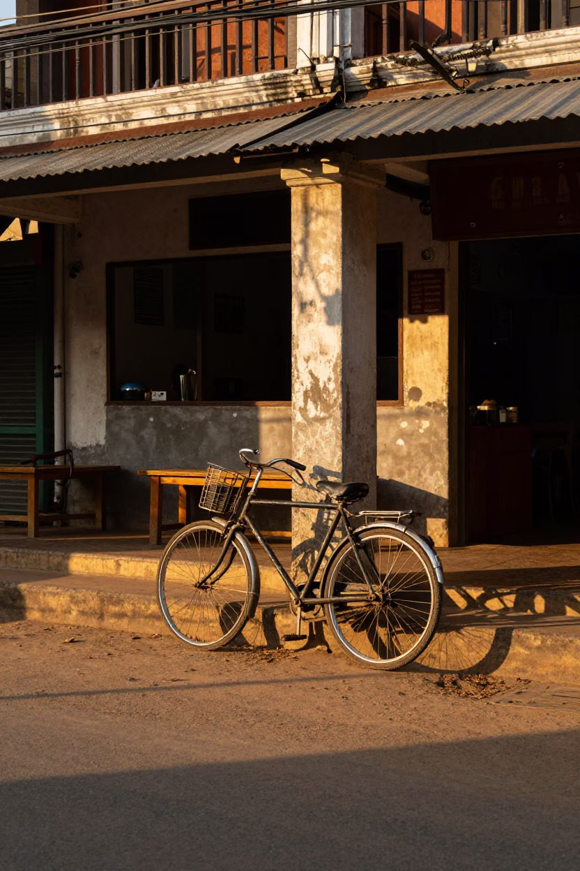Golden Hour Street Scene in Phnom Penh Cambodia with Bicycle and Local Architecture in in Phnom Penh, Cambodia