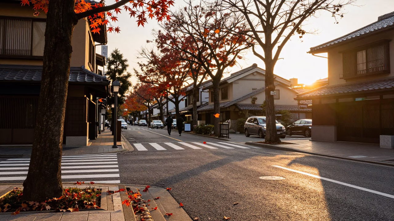 Golden Hour Street Scene in Tokyo Japan with Falling Maple Leaves and Traditional Architecture in in Tokyo, Japan