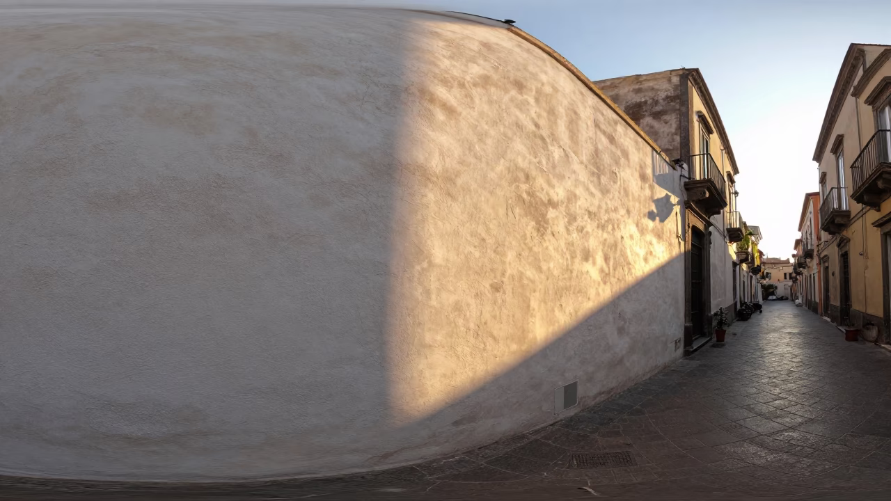 Golden Hour Sunlight Striking Plaster Wall in Historic Naples Italy Street Scene in in Naples, Italy