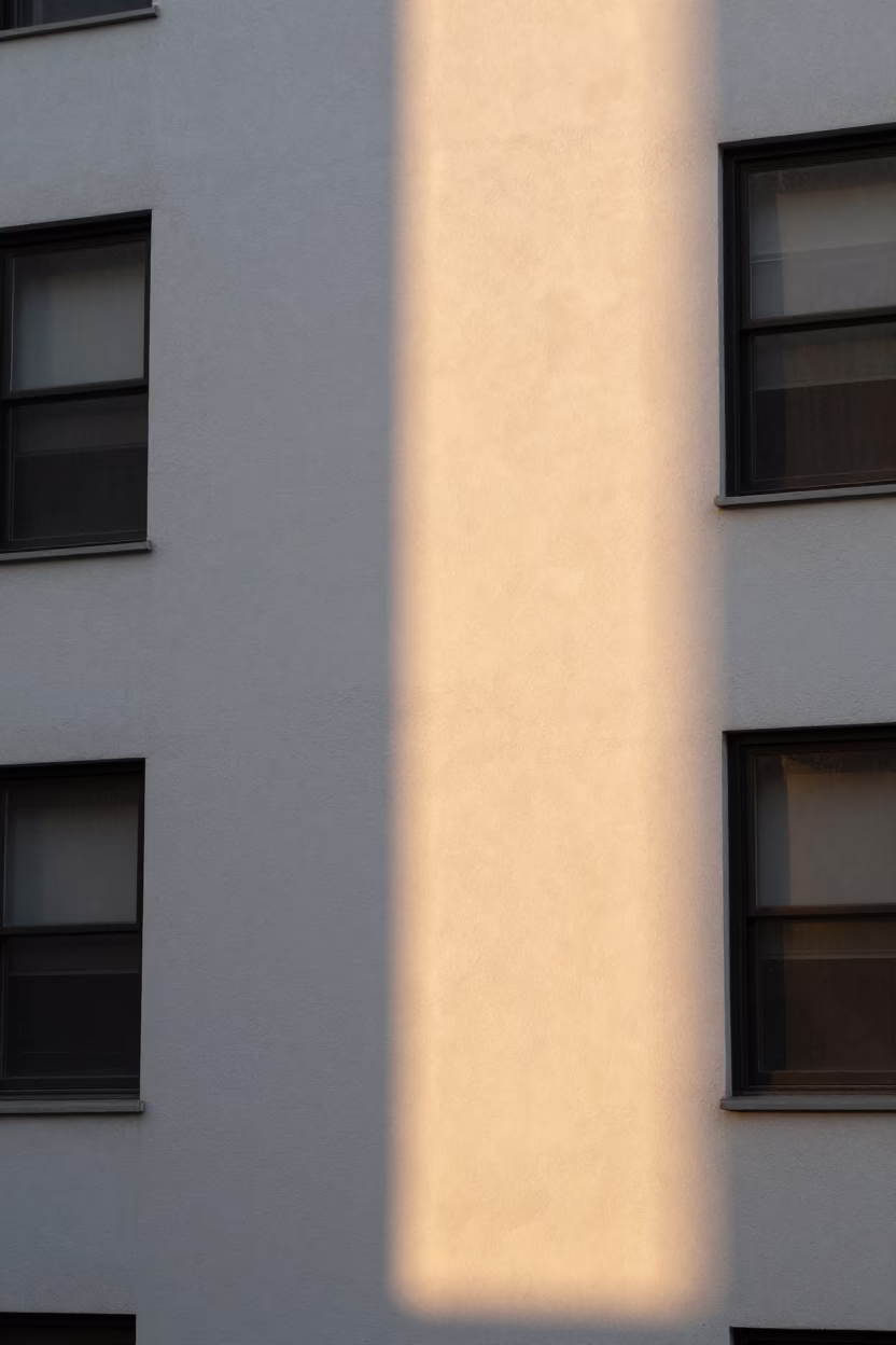 Golden Hour Sunlight Stripes Across Plaster Wall in New York City Apartment in in New York, New York, United States