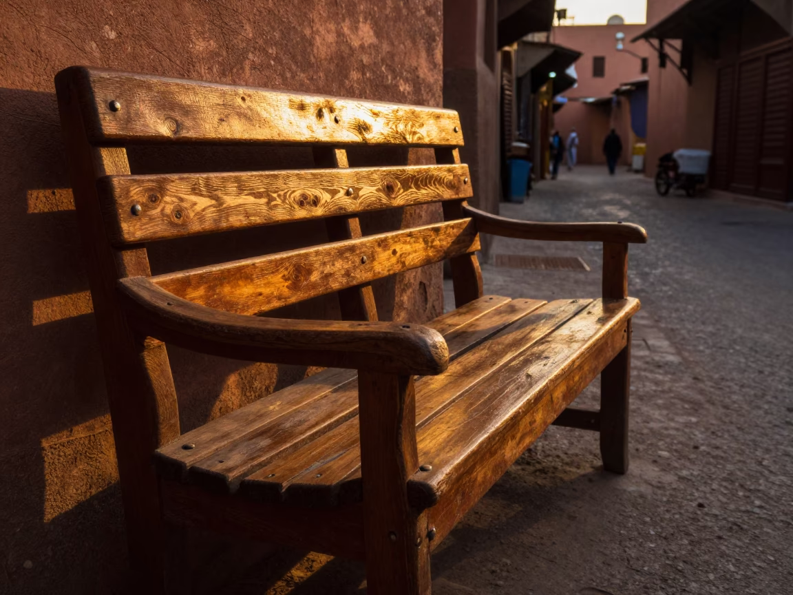 Golden Hour Sunlight Stripes on Wooden Bench in Marrakech Morocco Souk in in Marrakech, Morocco