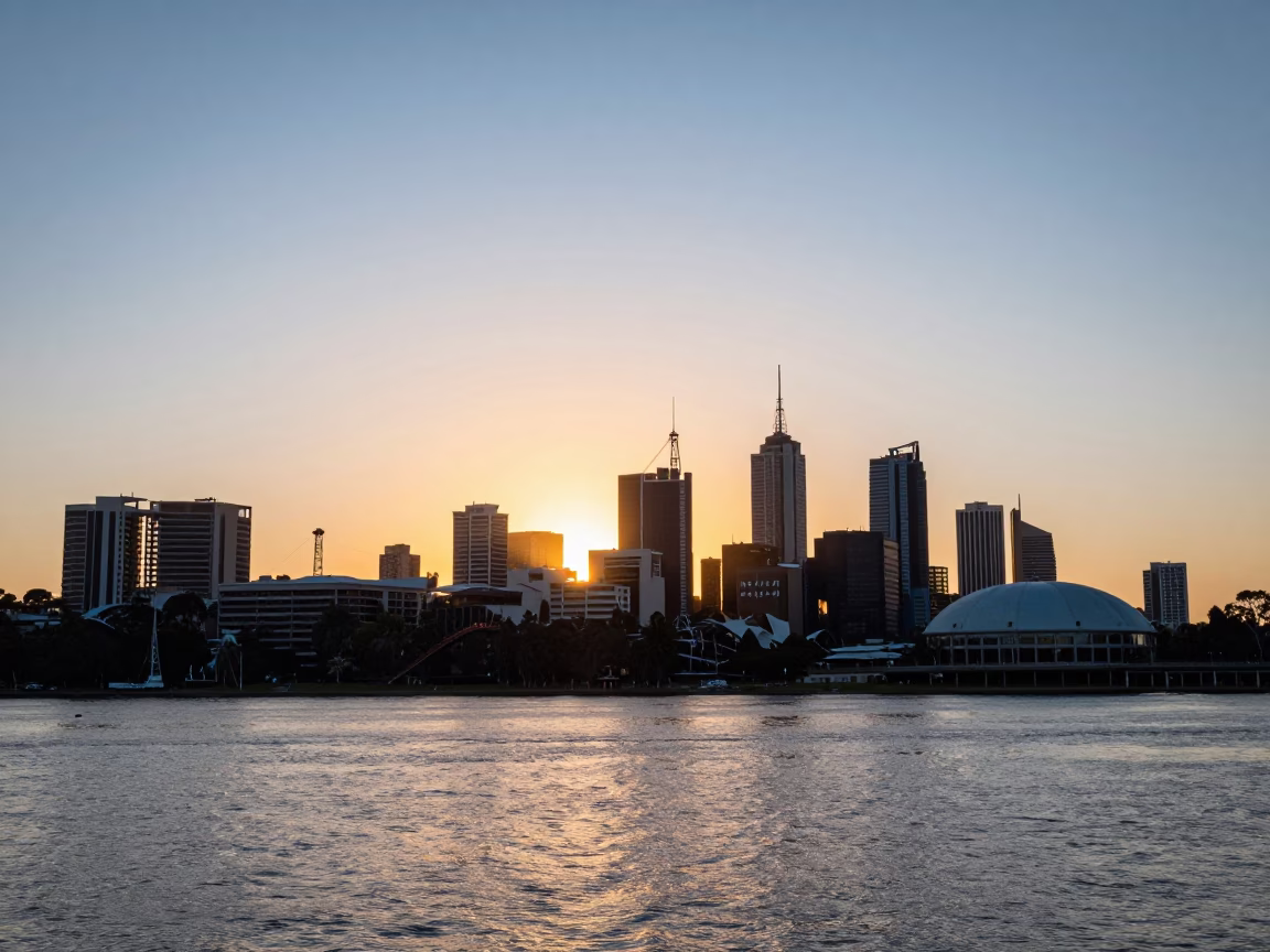 Golden hour sunset over Adelaide city skyline and River Torrens with pedestrians in in Adelaide, South Australia, Australia