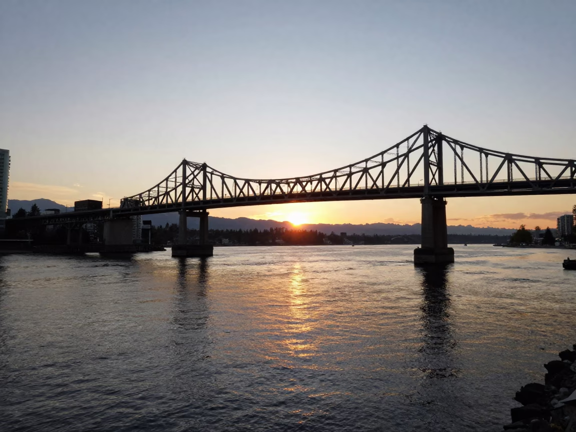 Golden Hour Sunset Over Burrard Street Bridge Maintenance Cradle Above English Bay Vancouver in in Vancouver, British Columbia, Canada