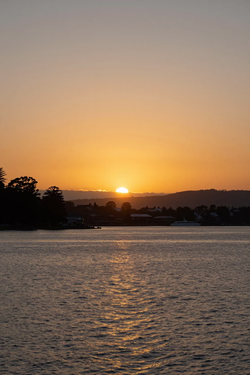 Golden Hour Sunset Over Hobart Waterfront with Sullivans Cove and Mount Wellington in in Hobart, Tasmania, Australia