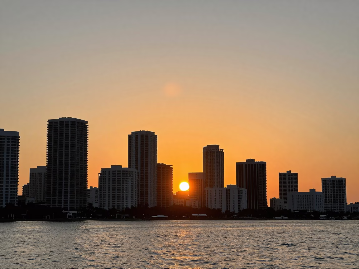 Golden Hour Sunset Over Miami Skyline with Colorful Art Deco Architecture and Palm Trees in in Miami, Florida, United States