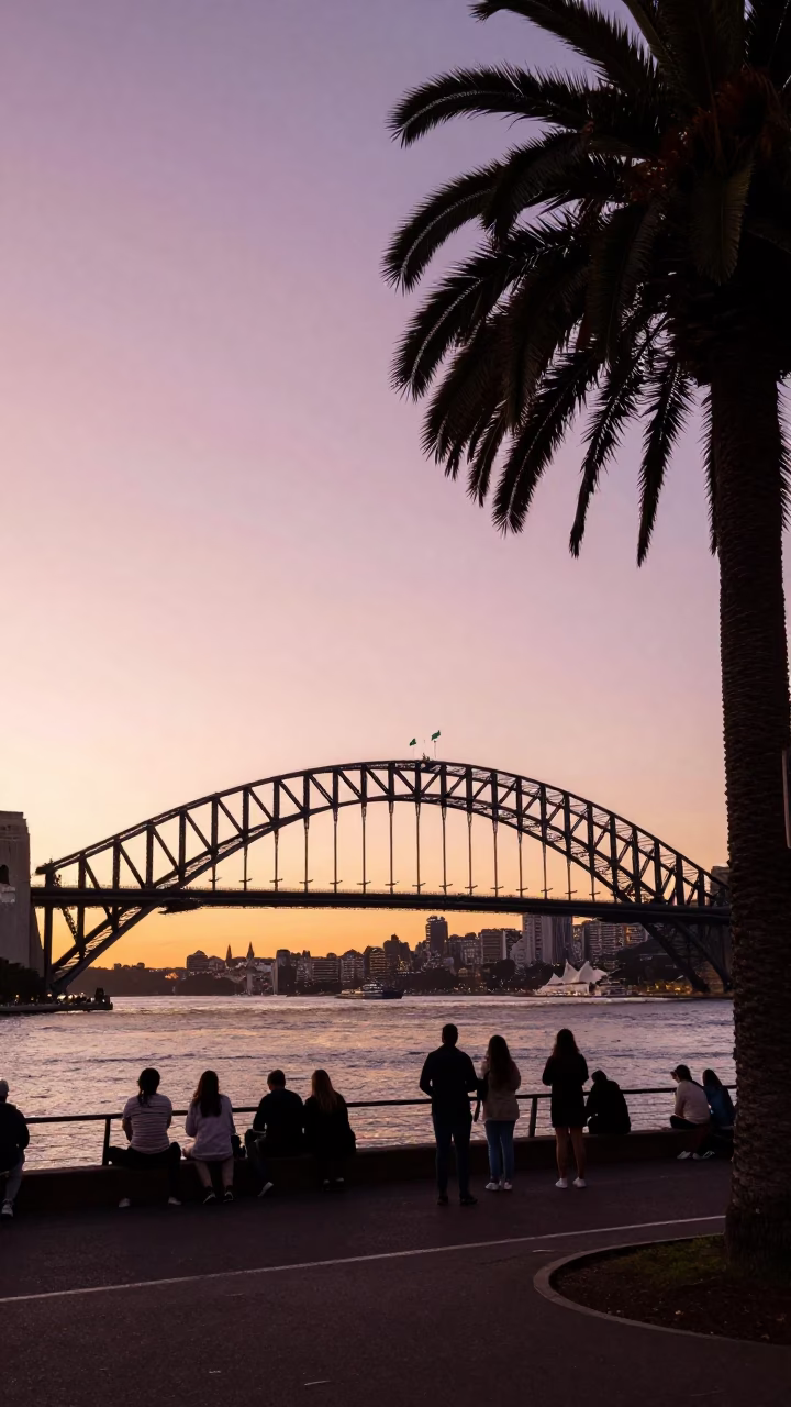 Golden Hour Sydney Harbour Bridge and Palm Tree Silhouette at Sunset in in Sydney, New South Wales, Australia