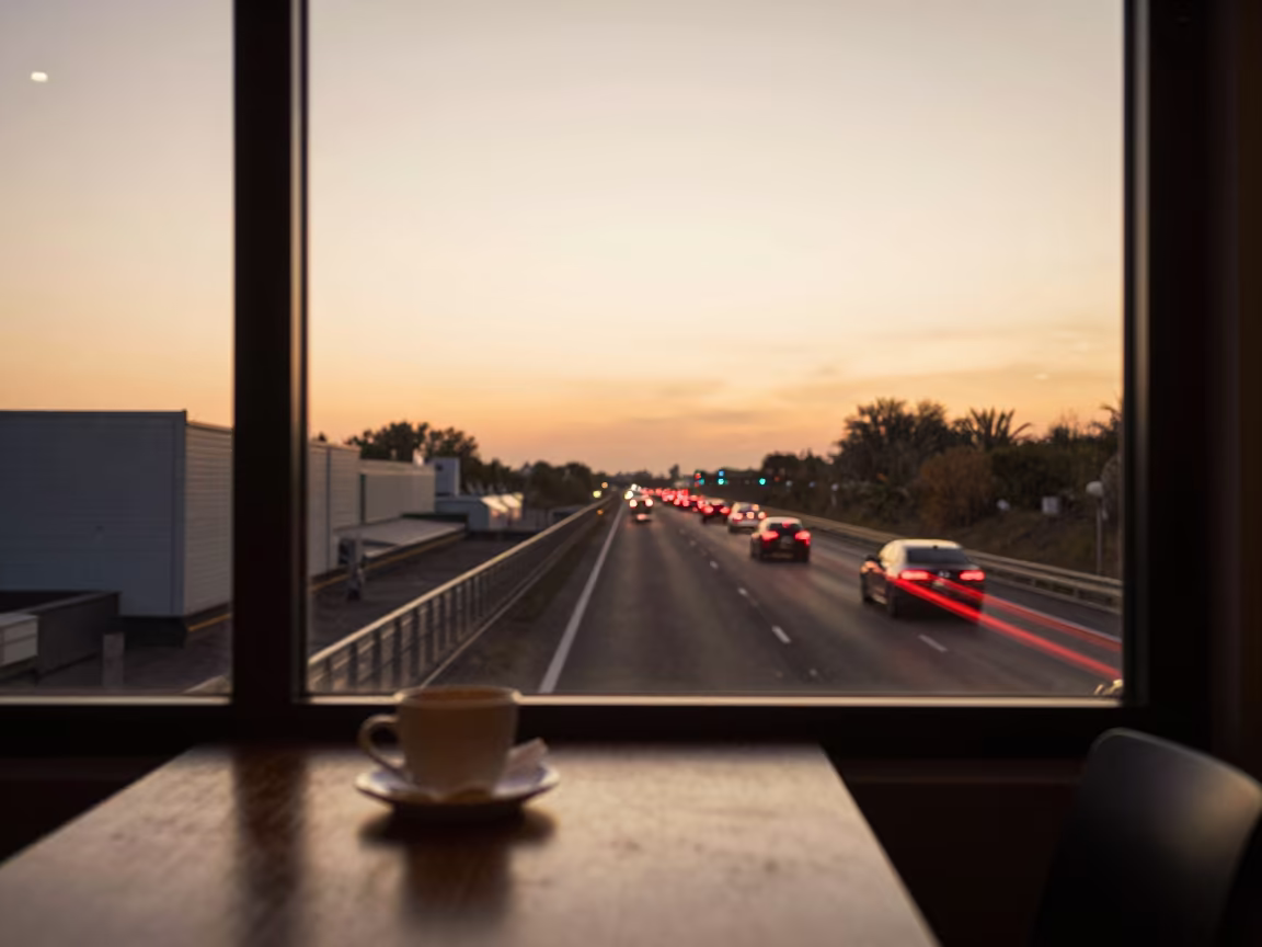 Golden Hour Taillights Highway View from Cafe in on a cafe table by a window near Aba