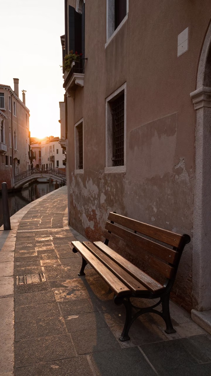 Golden Hour Venice Street Scene with Sunlight on Bench and Evening Sky in in Venice, Italy