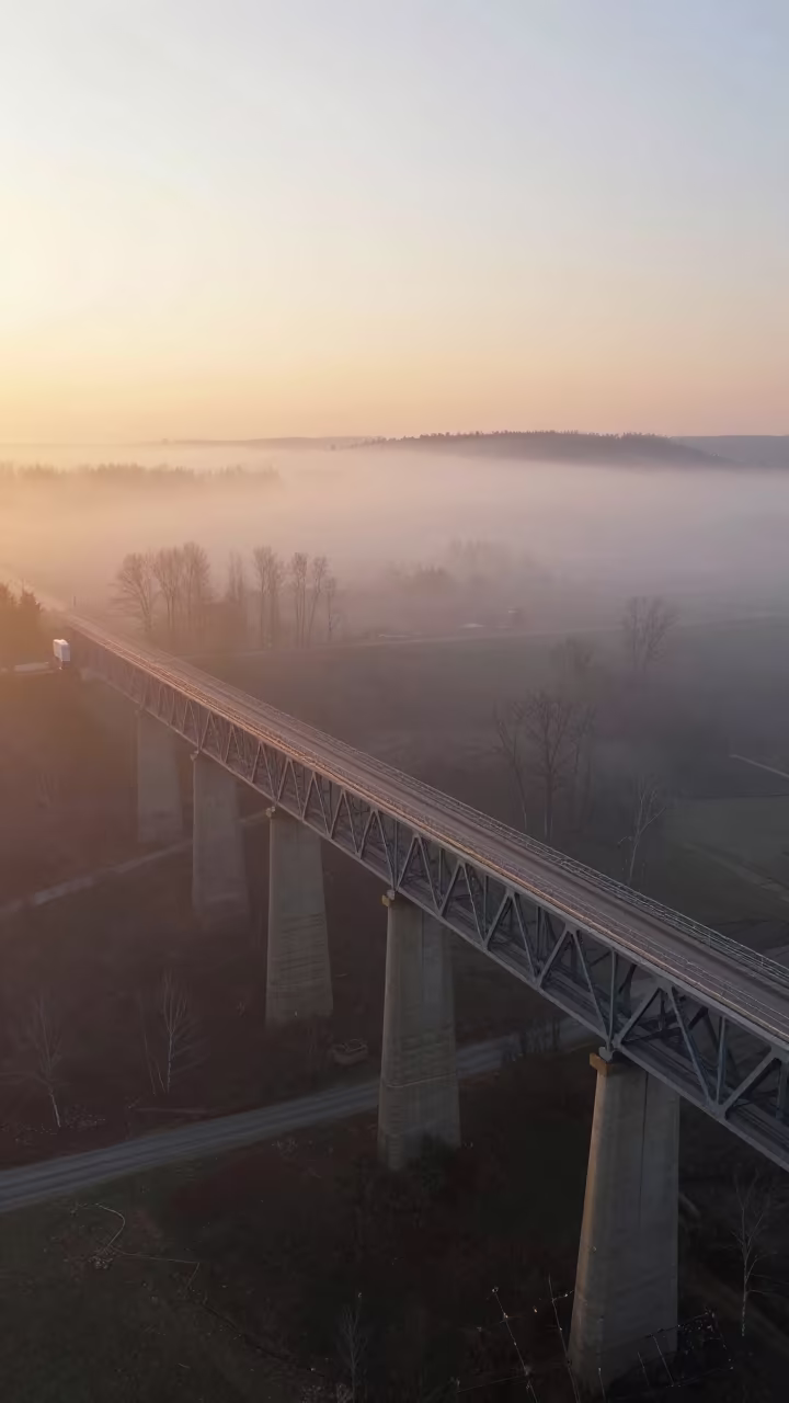 Golden Hour Viaduct Over Foggy Alberta Valley in along a bridge maintenance walkway in Alberta