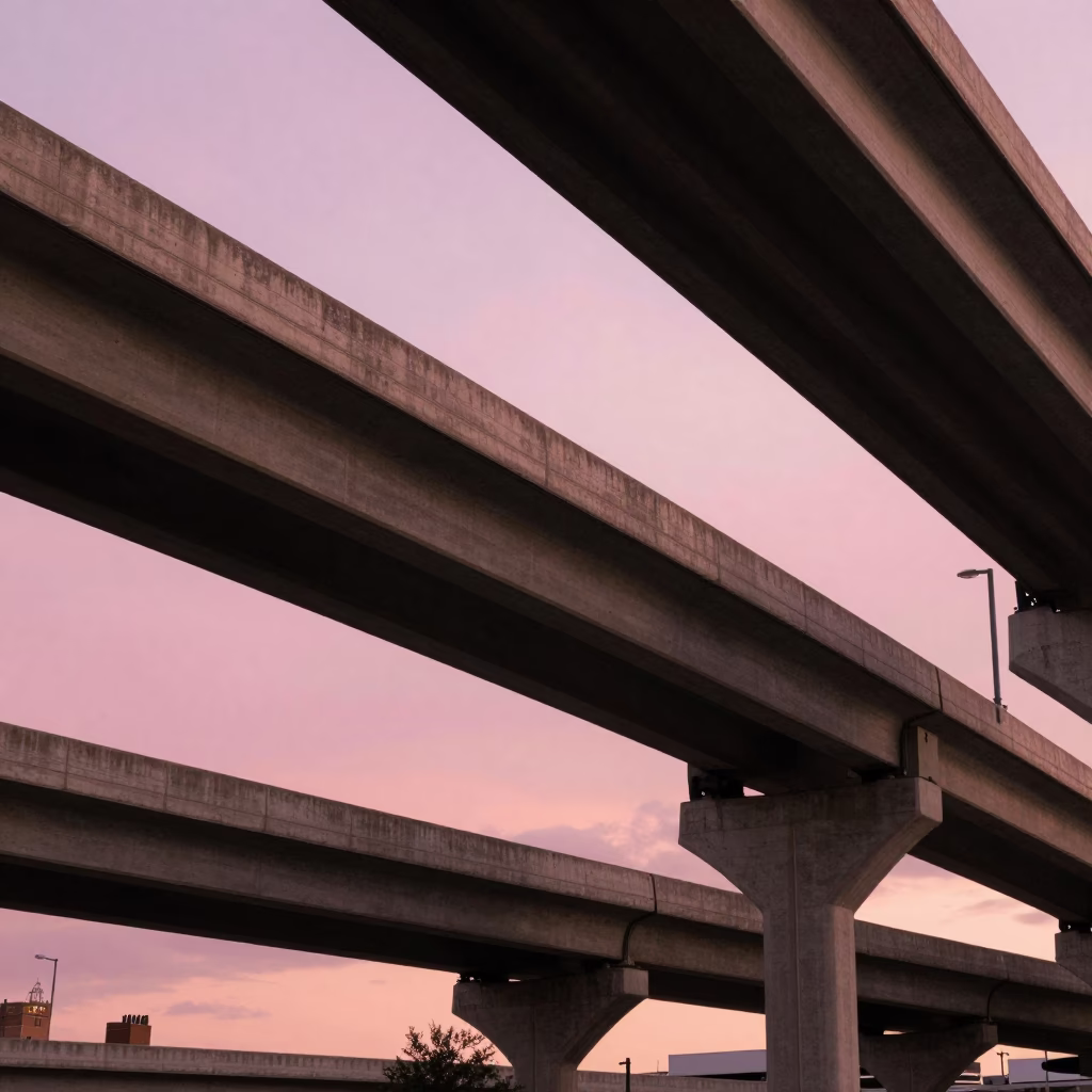 Golden Hour View of New Orleans Highway Flyover Stack Against Pink Evening Sky in in New Orleans, Louisiana, United States