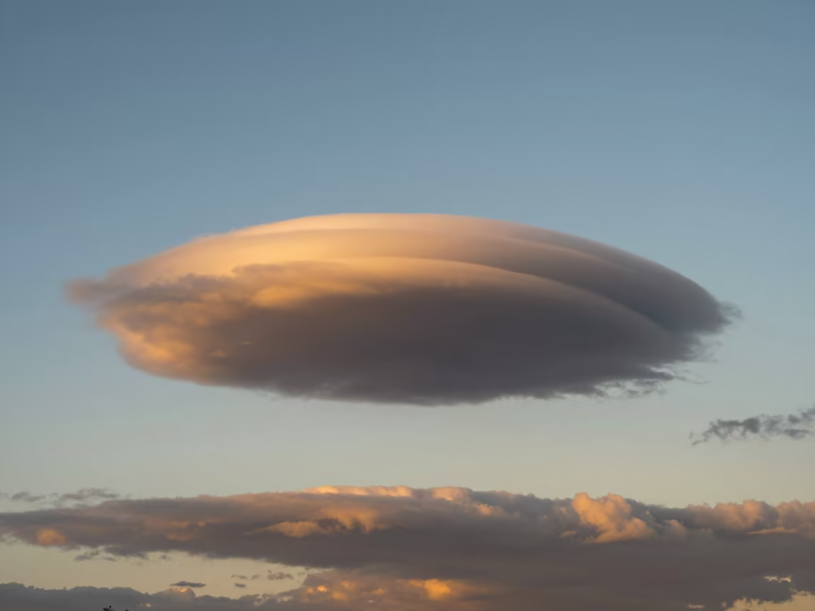 Golden Mammatus Clouds Over Suva Thunderheads in over a horizon of stacked thunderheads near Suva