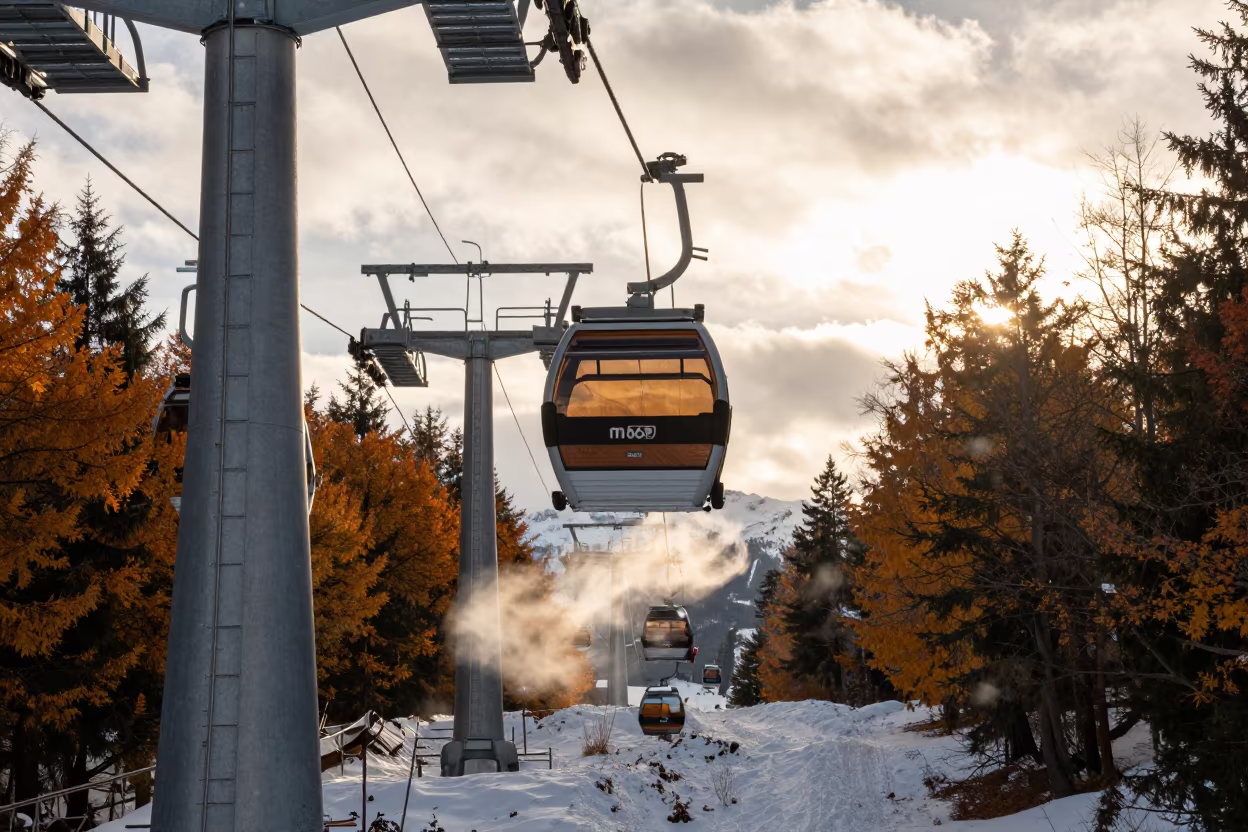 Gondola Cabin Rising Over Corduroy Snow in beside a lift tower above corduroy snow near Innsbruck