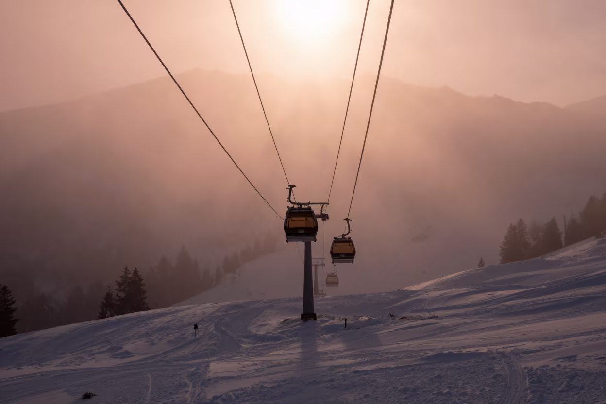 Gondola Silhouette on Alpine Piste at Dawn in on an alpine piste at first light near Innsbruck