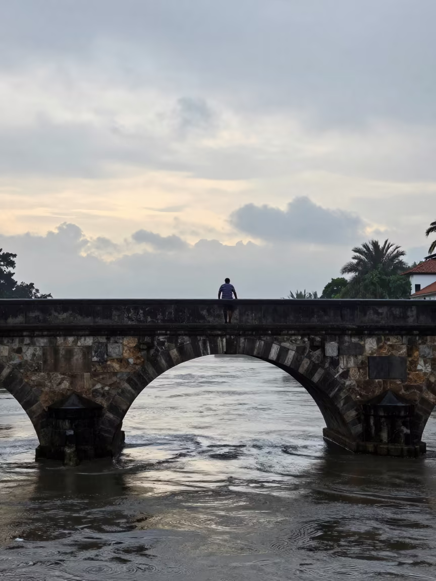 Gondolier Under Stone Bridge in Dawn Light in near San Carlos