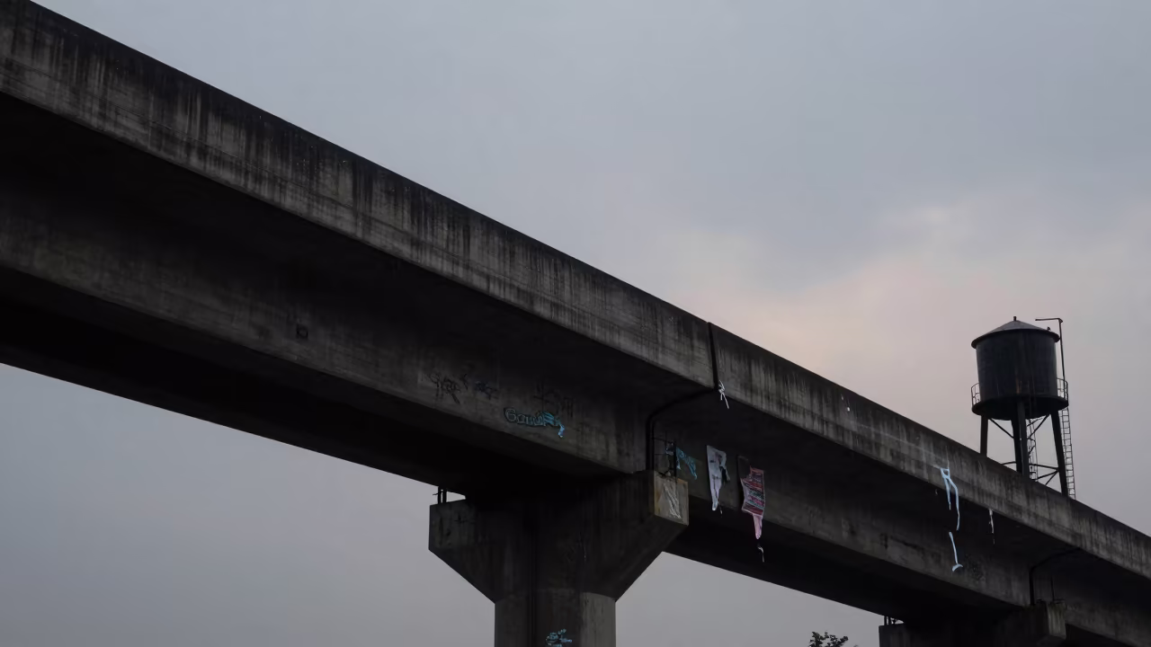 Graffiti Pier Silhouette at Twilight in Bhagalpur in beside a water tower ladder in Bhagalpur