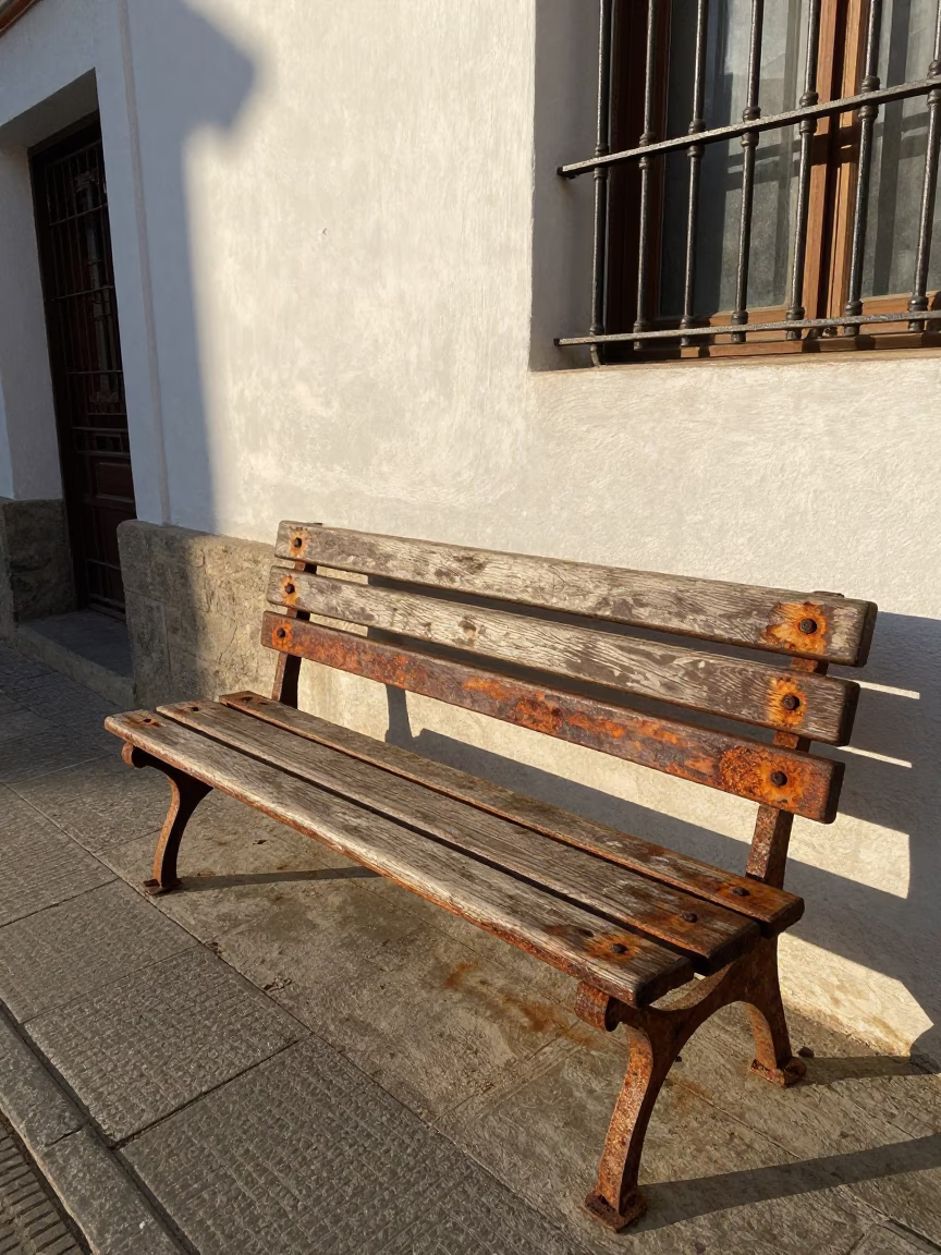 Granada Spain Late Morning Street Scene with Rusty Bench and Wool Scarves in in Granada, Spain