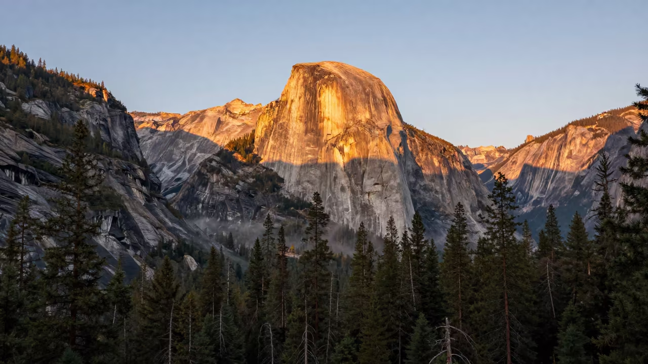 Granite Dome Rising Over British Columbia Forest in across a wide valley floor in British Columbia