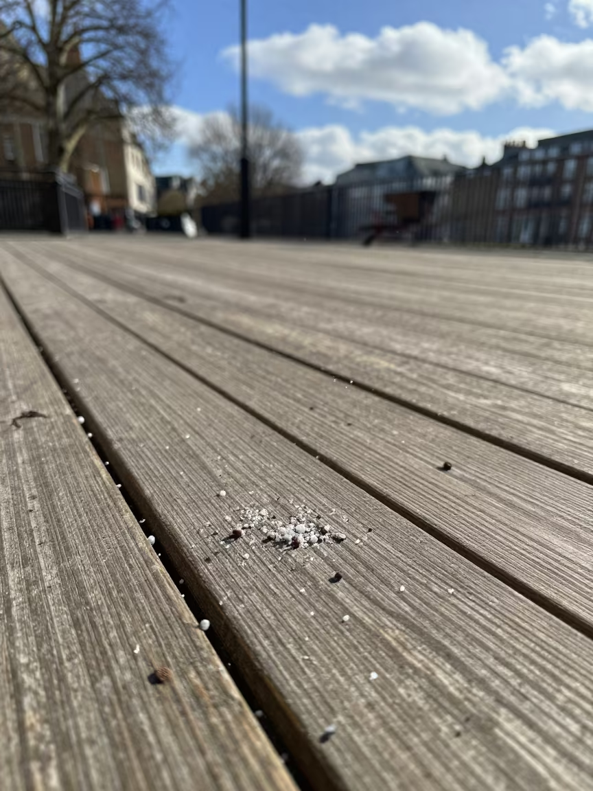 Graupel Bouncing on London Deck in beneath fast-moving cloud bands near Soho, London