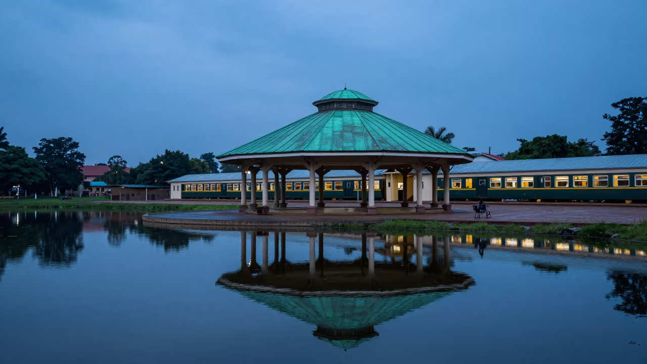 Green Copper Pavilion Twilight Lake Reflection in inside a restored train terminal in Bobo-Dioulasso