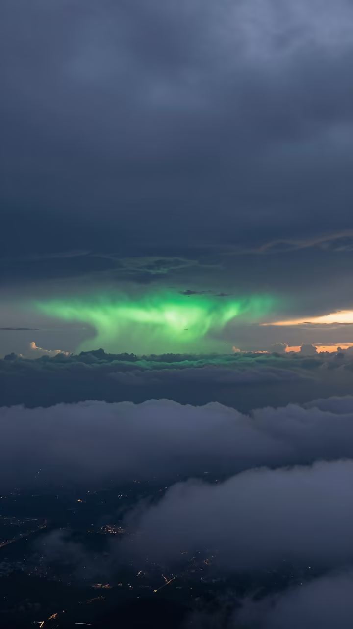 Green Flash Above Stacked Thunderheads at Sunset in over a horizon of stacked thunderheads near Haiphong