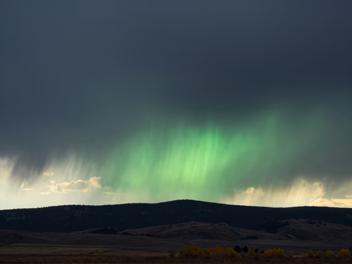 Green Flash Sunset Over Idaho Rain Storm in beneath fast-moving cloud bands in Idaho