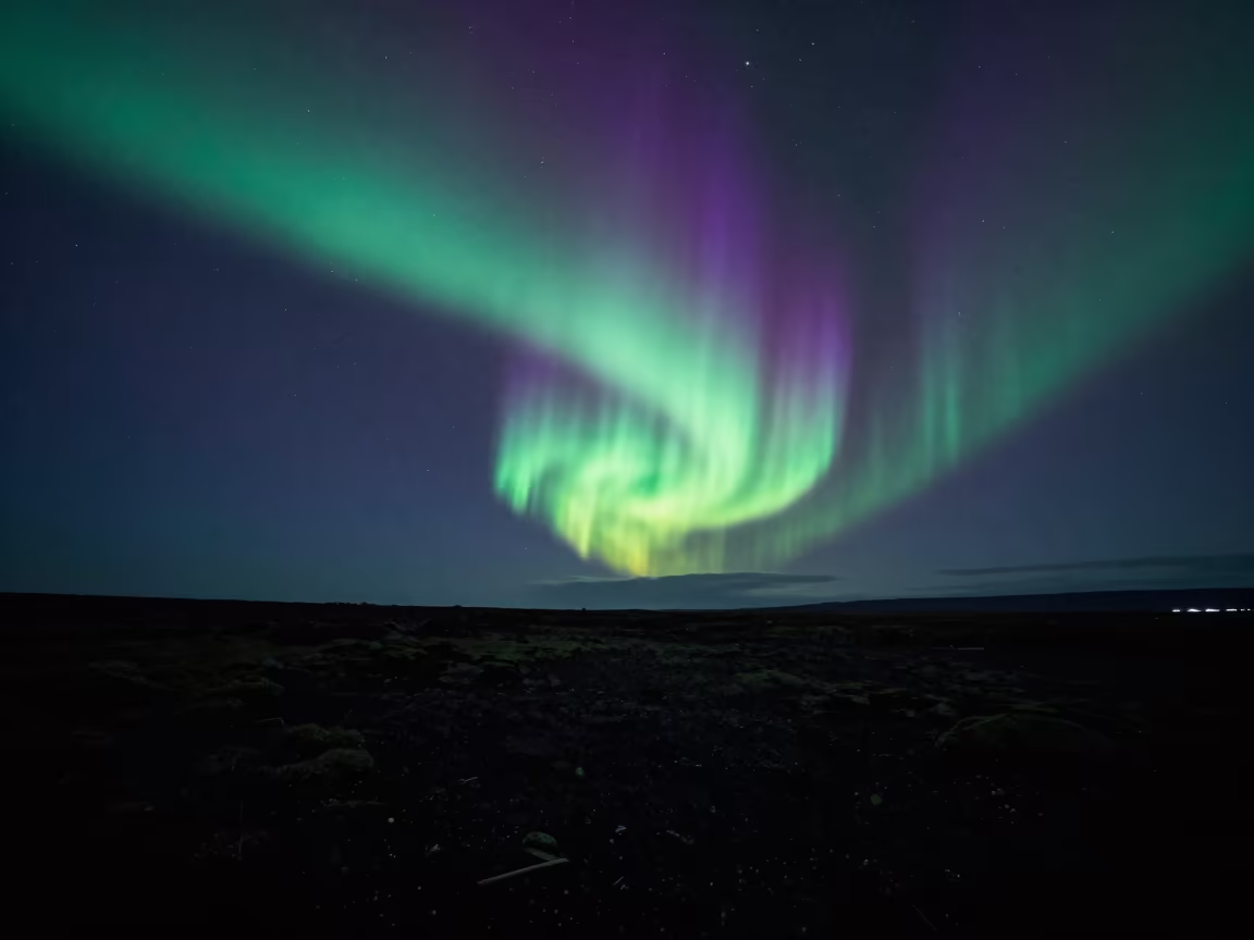 Green Purple Aurora Trail Over Iceland Night Sky in under a band of cold starlight in Iceland