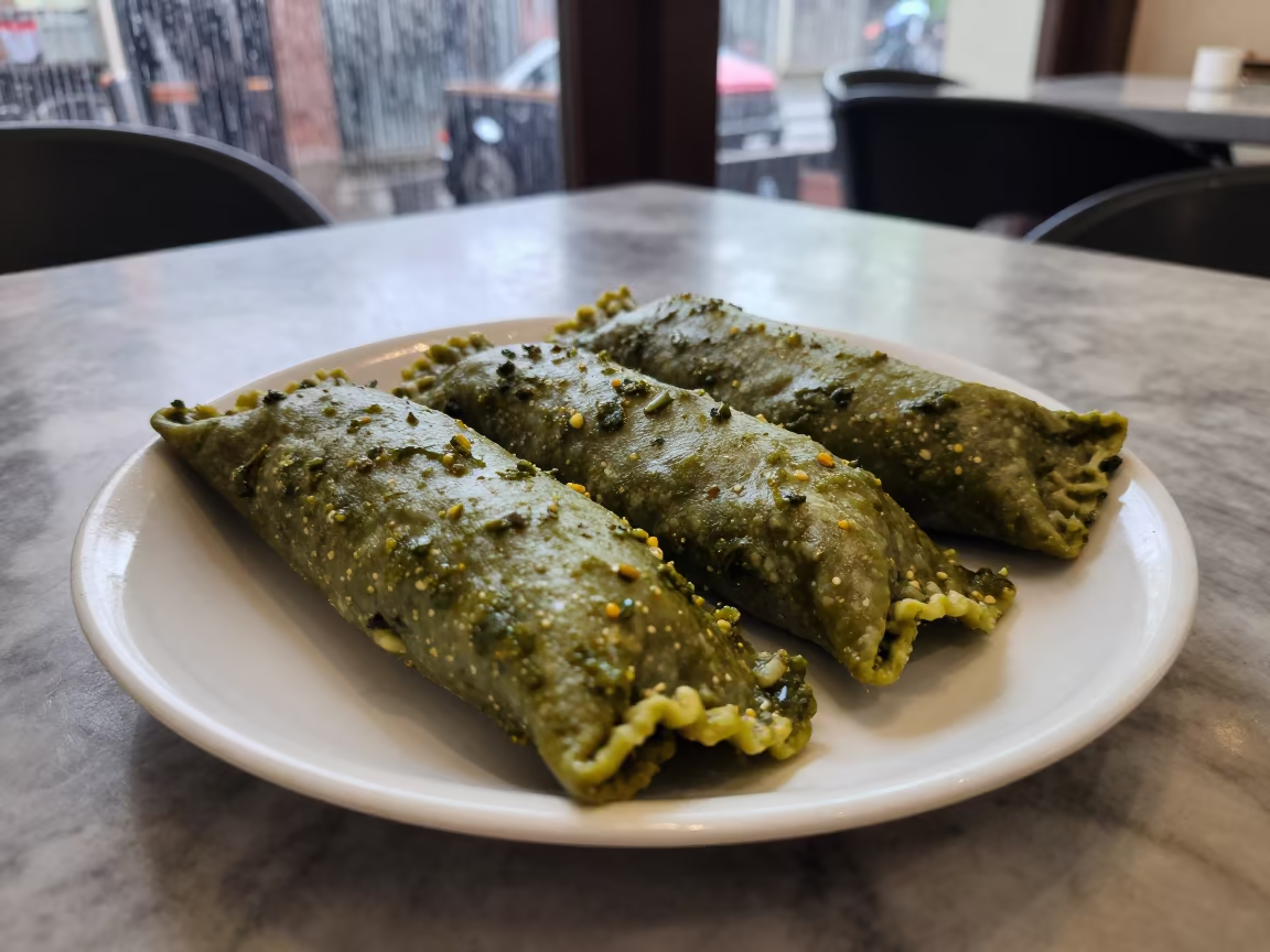 Green Salsa Enchiladas on Marble Cafe Table in on a marble cafe table in Sangli