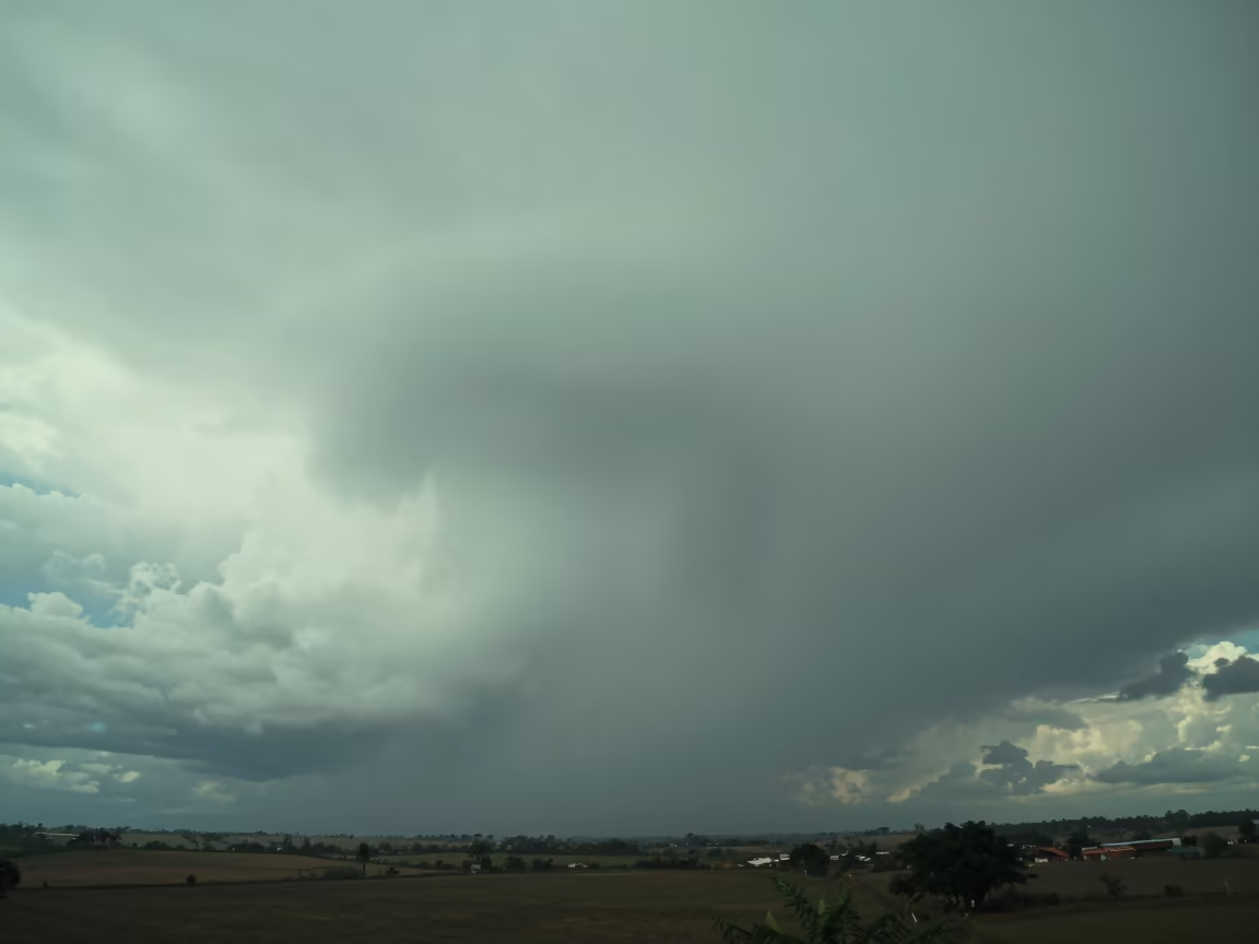 Green-Tinted Wall Cloud Base Monsoon Huambo in beneath fast-moving cloud bands near Huambo
