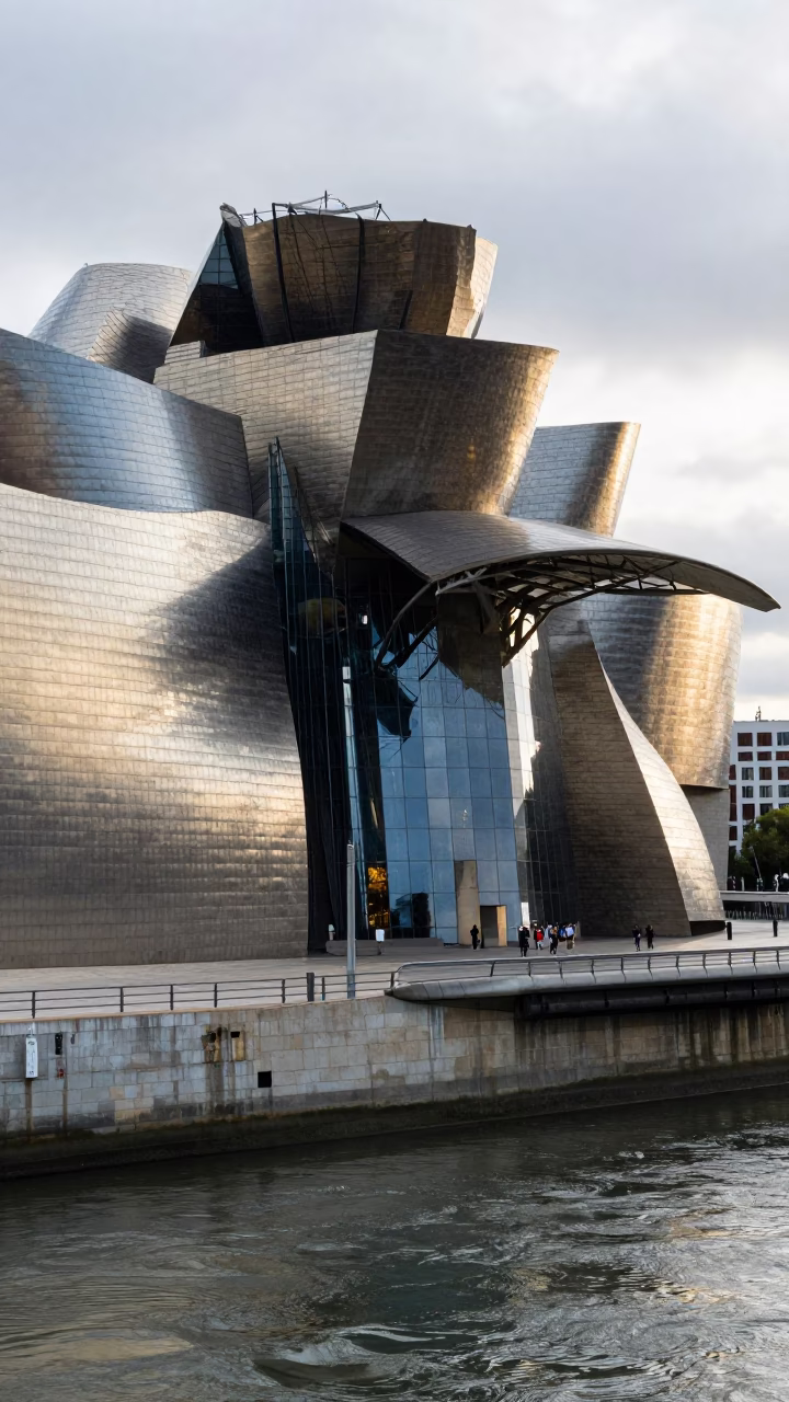 Guggenheim Bilbao Glass Facade Reflections Early Afternoon Street Scene in in Bilbao, Spain