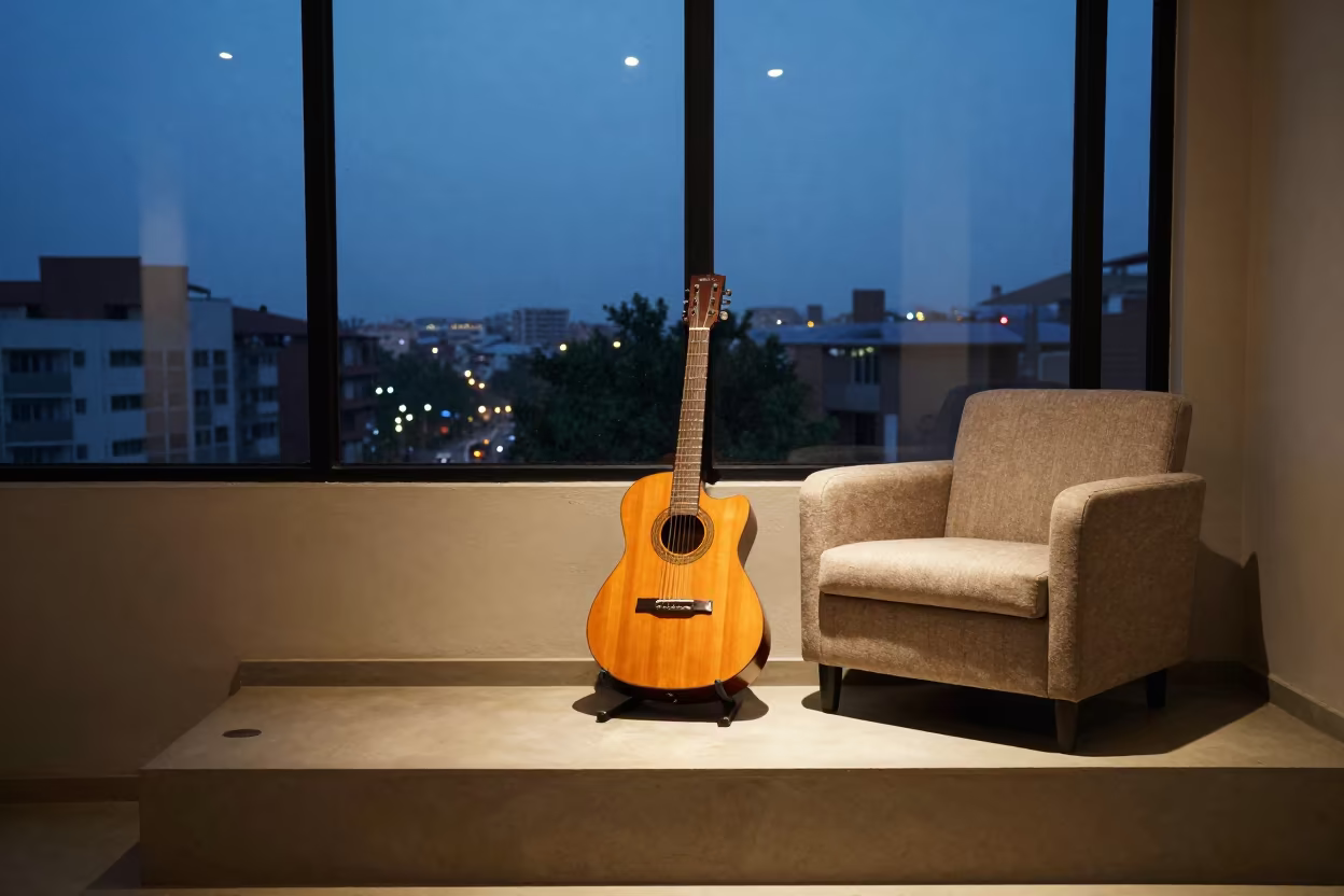 Guitar Leaning on Ledge in Bujumbura Room in on a painted display ledge in Bujumbura